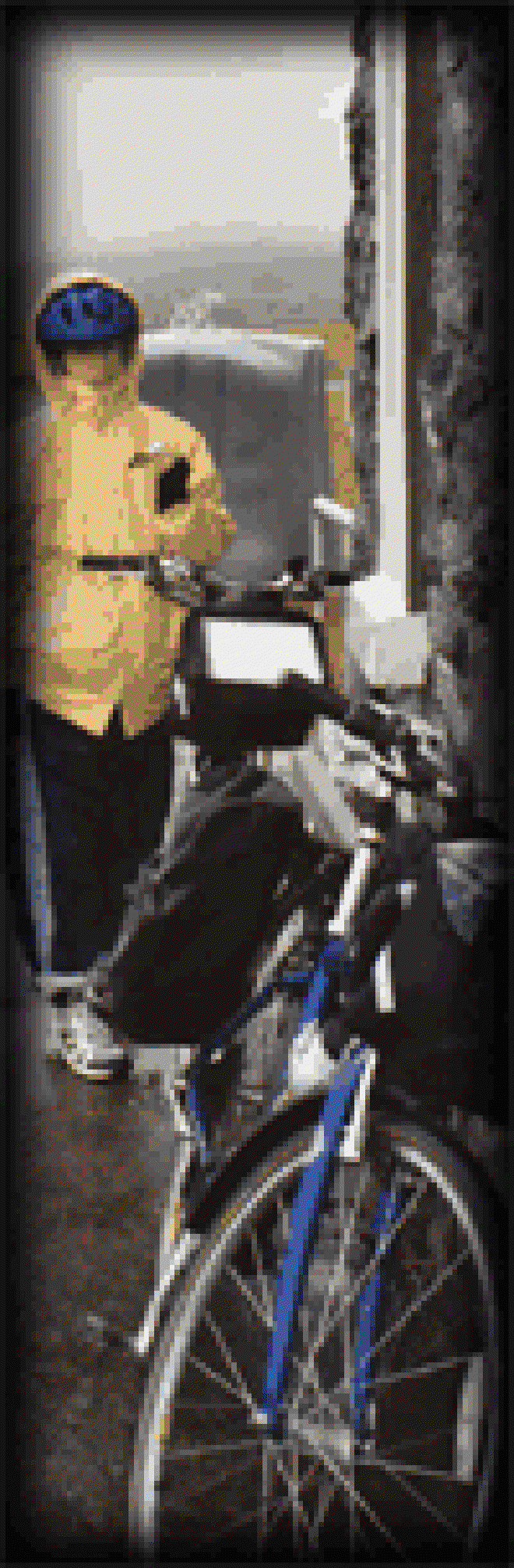 Carolyn eats a Mars bar by a rest stop on the coast road